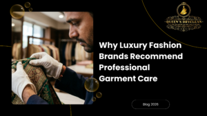 Specialist handling a delicate luxury garment with embroidery for professional garment care